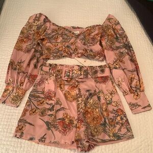 Boutique pink multi-colored floral two piece romper.